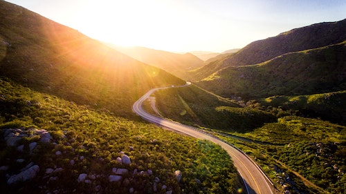 picture of winding road leading to sunlight representing a journey in mindfulness
